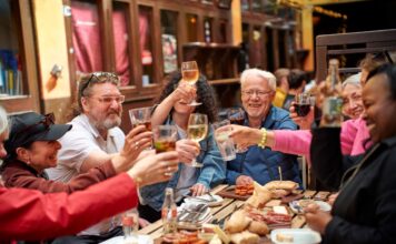 Why Cork Should Be Your Next Food-Filled Escape When it comes to planning a short break in Ireland, Cork has all the ingredients. Scenic drives, bustling markets, amazing meals, a chance to meet passionate producers and perhaps a few hidden treats discovered along the way. Whether it’s a spontaneous weekend away, a catch-up with friends or a family escape, Cork offers visitors the opportunity to slow down, explore and, most importantly, eat exceptionally well. It’s no secret that Cork has long been known as one of Ireland’s most exciting food regions. From the iconic 18th-century English Market in the heart of the city and the renowned gourmet town of Kinsale to its artisan cheesemakers, craft producers, and farmers who cultivate exceptional local ingredients across the region, food is deeply woven into the fabric of everyday life. Combined with a thriving restaurant scene and a rich culinary heritage, Cork’s reputation as Ireland’s food capital is well deserved. The county’s reputation has deep roots. For centuries, Cork has been synonymous with exceptional ingredients, with Cork Harbour serving as the main gateway for Irish food exports during the 18th and 19th centuries. Today, that legacy continues to thrive. Around 60% of Ireland’s artisan food producers are based in Cork, creating a vibrant food culture that champions local, seasonal and sustainable food. The county also boasts the highest concentration of Michelin-starred restaurants in Ireland, alongside independent cafés, historic pubs, local breweries and an ever-growing number of distilleries. That reputation continues to grow. Cork recently received another major culinary accolade when Cork on a Fork Fest (12-16 August) was named the No. 1 Summer Food Festival in Europe, further cementing the county’s position as one of the continent’s most exciting food destinations. The recognition reflects not only the quality of events over the week but Cork’s food offering in general – the passion of its producers, chefs, restaurateurs and food communities who continue to champion local food and unique culinary experiences. Now, Visit Cork’s new Experience Cork campaign is inviting visitors to discover the county through food and experience the people, places and flavours that have earned Cork its reputation. Through a collection of curated food trails, brewery and distillery tours, producer visits, culinary tours and hands-on food experiences, newly developed itineraries encourage visitors to delve deeper into the stories behind Cork’s thriving food scene. A Weekend Built Around Food One of Cork’s greatest strengths is that food experiences are never far away. Start the day wandering through the historic English Market, where traders greet regulars by name and visitors can browse everything from local cheeses and fresh seafood to traditional tripe and drisheen and artisan baked goods. Join a guided food tour like Cork Culinary Tours and you’ll uncover not only the flavours of Cork, but the stories and personalities that have shaped its food culture for generations. From the city, the food trail extends in every direction. Head south to Kinsale, where colourful streets are lined with cafés, restaurants and food producers. Join Kinsale Food Tours, sample local specialities and hear the stories behind one of Ireland’s best-loved food destinations. For something completely different, venture west to the Gaeltacht region of Mhuscraí, where O Tuama Tours offers visitors the opportunity to meet Italian Water Buffalo before sitting down to taste handcrafted cheeses produced on the family farm. It’s a uniquely Cork experience that combines food, farming and storytelling in equal measure. Meanwhile, artisan chocolatier and pastry cafe Praline provides a fascinating glimpse into the world of handcrafted chocolate, revealing the creativity and craftsmanship behind every piece. The Experience Cork campaign also highlights opportunities to explore local breweries and distilleries, meet producers at the source and enjoy hands-on culinary experiences that connect visitors directly with the ingredients, traditions and people that make Cork’s food scene so distinctive. *** What sets Cork apart isn’t just the quality of the food – it’s the people behind it. Across the county, producers, chefs, market traders and food entrepreneurs are eager to share their stories. Visitors are welcomed into farms, kitchens and workshops, offering a rare opportunity to see first-hand how local food is grown, crafted and celebrated. It’s this sense of connection that sits at the heart of the Experience Cork campaign. The initiative shines a spotlight on the makers, growers and guides who bring Cork’s food culture to life, giving visitors an opportunity to engage with the county in a more meaningful way. Of course, a trip to Cork is never just about the food. It’s about getting out on the water and into the landscape, and meeting the locals who are true characters. A morning food tour can be followed by a walk along the coast, a kayaking adventure, a visit to a picturesque harbour town or an afternoon exploring galleries, shops and local attractions. It’s one of the reasons Cork works so well as a short-break destination. Everything feels connected – the food, the landscape, the people and the sense of place. Because while Cork may be famous for its food, it’s the people, stories and experiences behind every bite that make it unforgettable. Visitors can explore newly curated itineraries and get inspiration for planning their own Cork food experience at purecork.ie/ExperienceCork, helping them build memorable short breaks centred on the people, food and adventures that define the county. #ExperienceCork